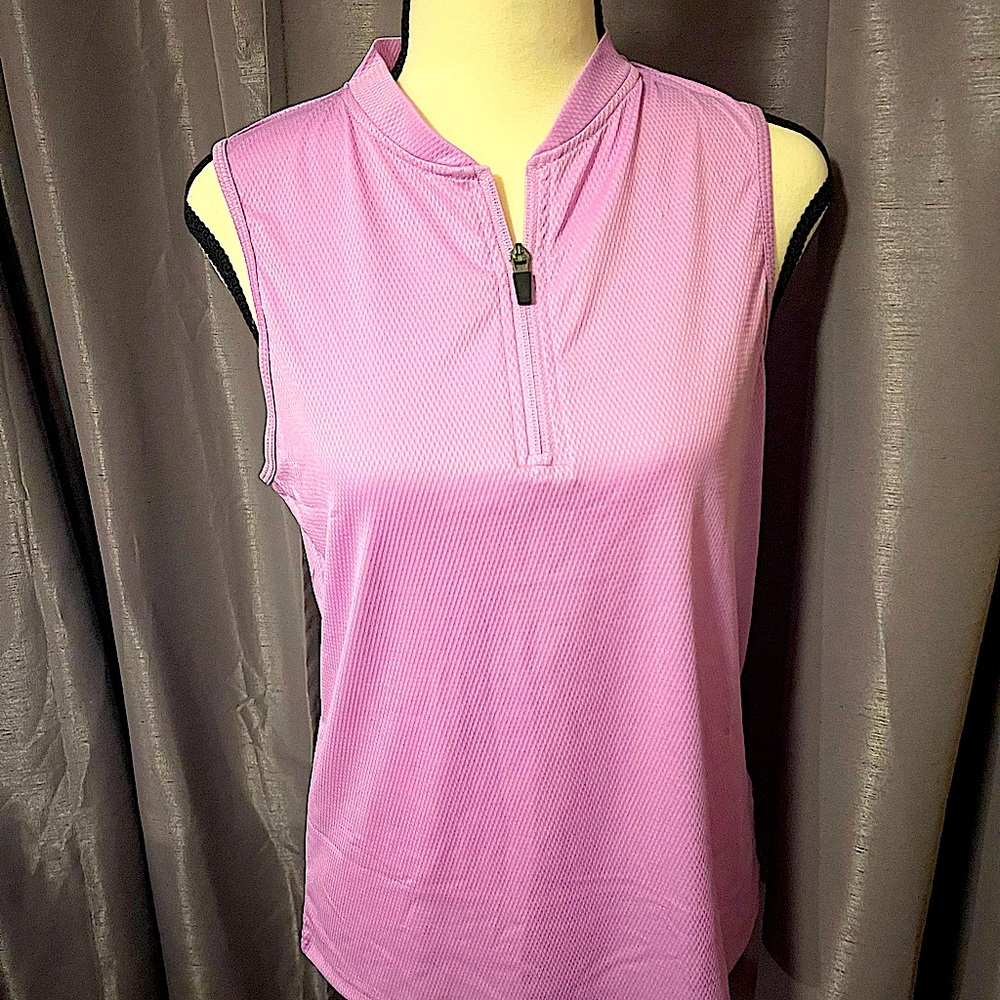 A pink golf shirt by SPRING SEASON.